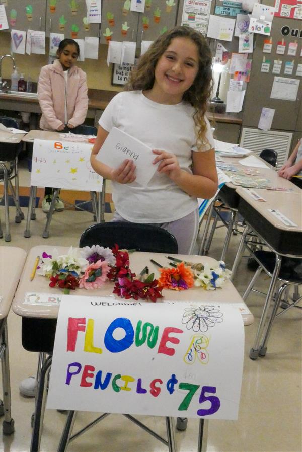 girl selling flower pencils